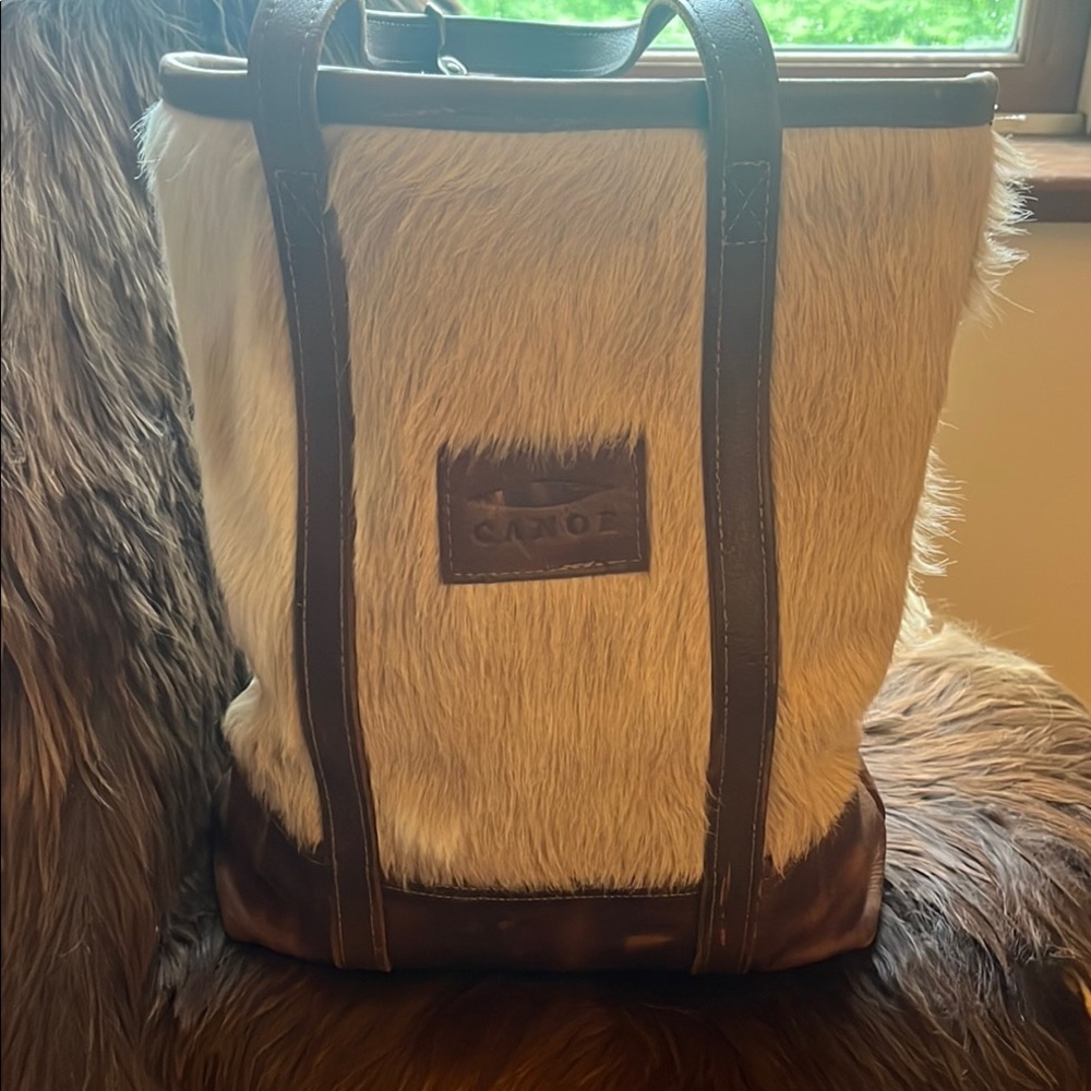 Canoe cowhide bag